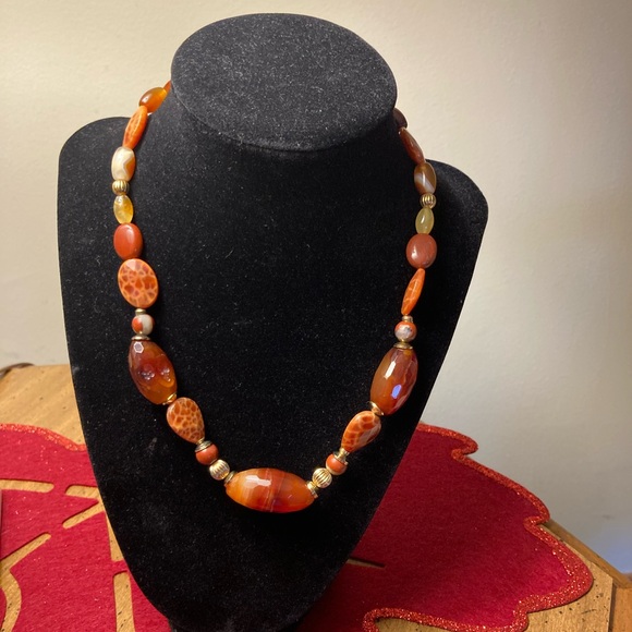 Jewelry - This is a Carnelian gemstone beaded necklace with gold-tone clasp.